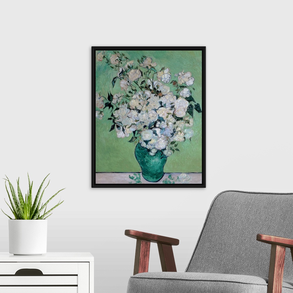 A modern room featuring Painting on canvas of flowers in a vase with a few petals on the table it is sitting on.