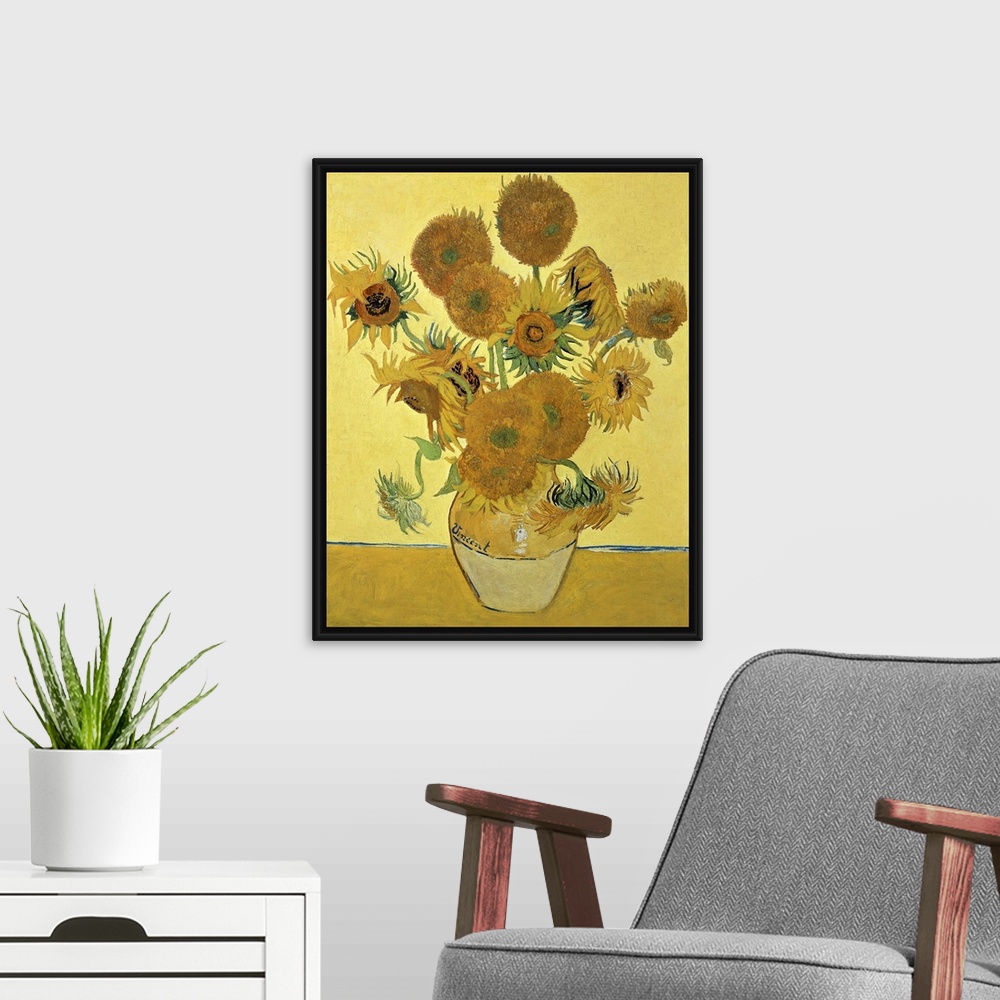 A modern room featuring Vincent Van Gogh's famous oil on canvas painting of sunflowers in a vase in warm tones.