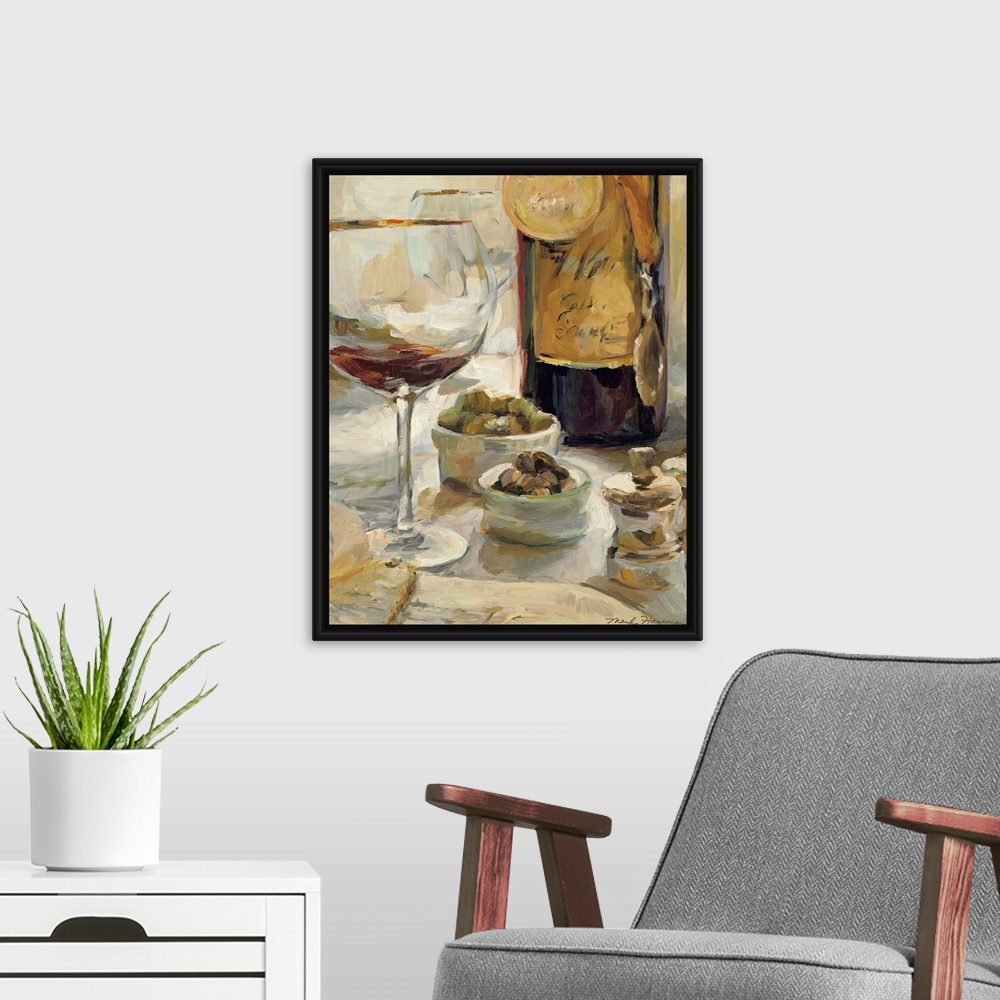 A modern room featuring Painting depicting a nearly empty glass of wine and a wine bottle with award medals hanging aroun...