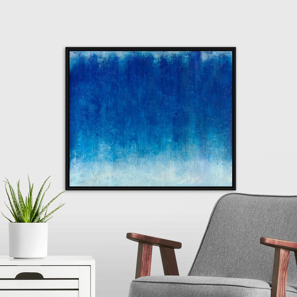 A modern room featuring A horizontal monochromatic abstract painting with beautiful textures.