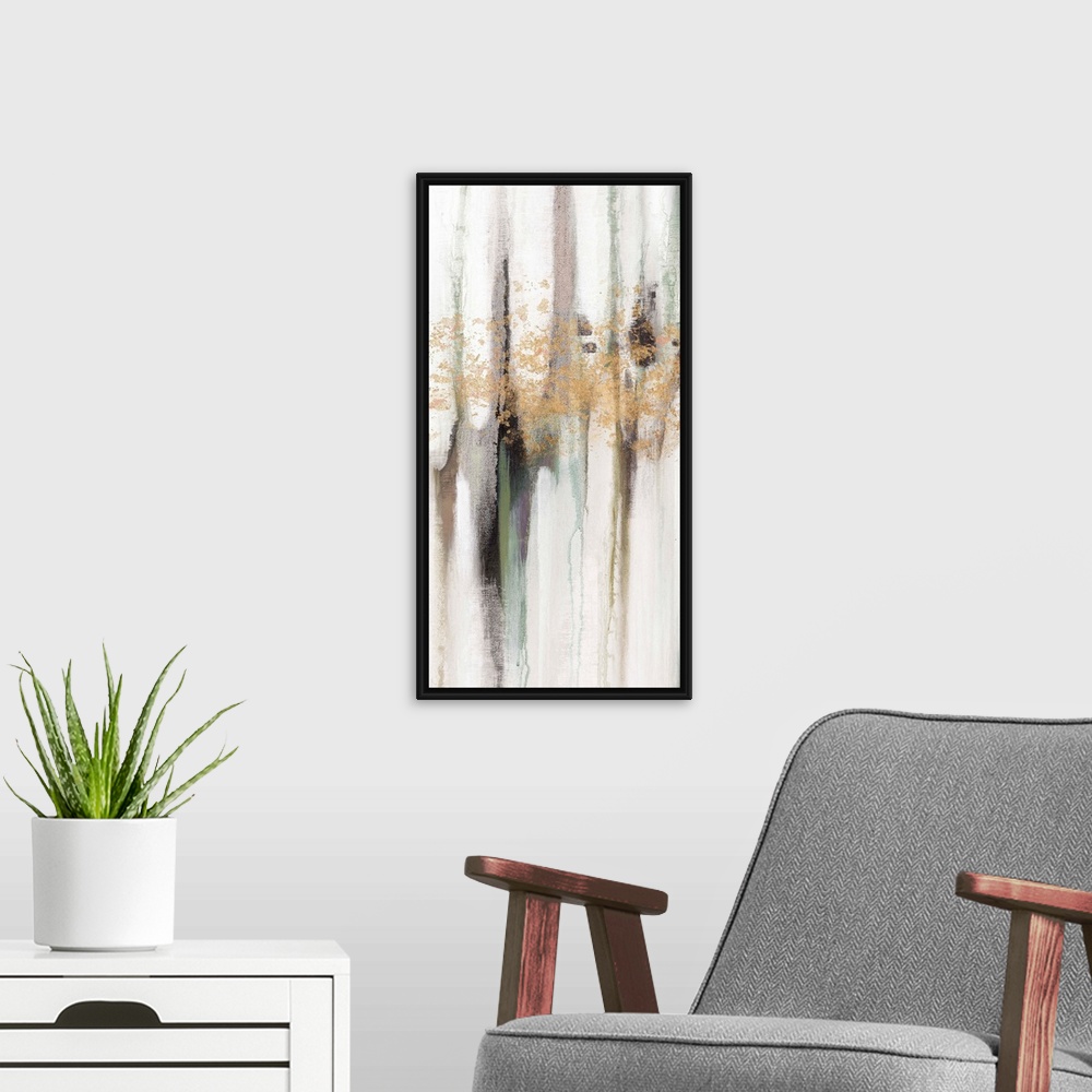 A modern room featuring Contemporary abstract painting using tones of pale gray and gold splashes of color.