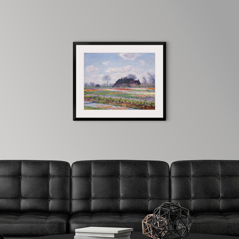 A modern room featuring Huge classic art depicts a field in the Netherlands covered in an array of brightly covered flowe...