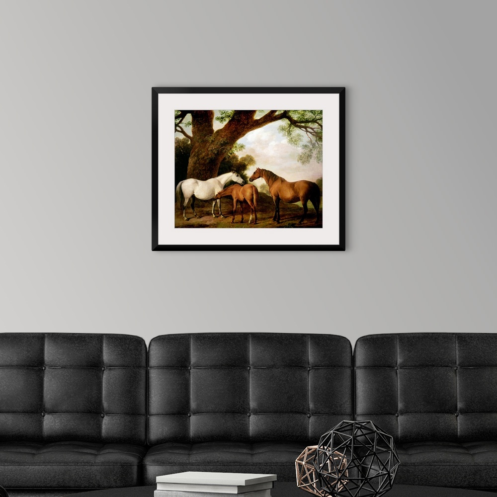 A modern room featuring Giant classic art focuses on three horses standing beneath a very large tree on the edge of a for...