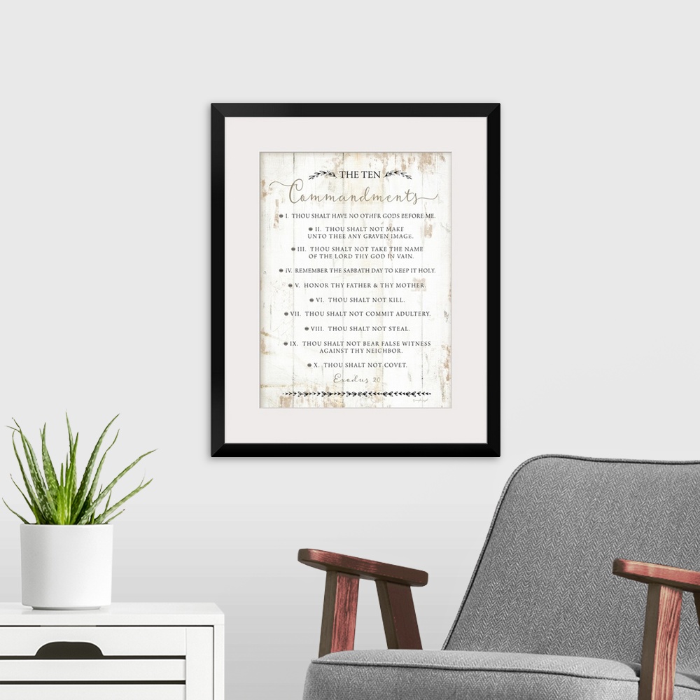 A modern room featuring The Ten Commandments on a white shiplap wood background.