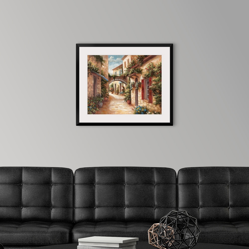 A modern room featuring A traditional style painting of a cobblestone alleyway in an Italian village, with doors and wind...