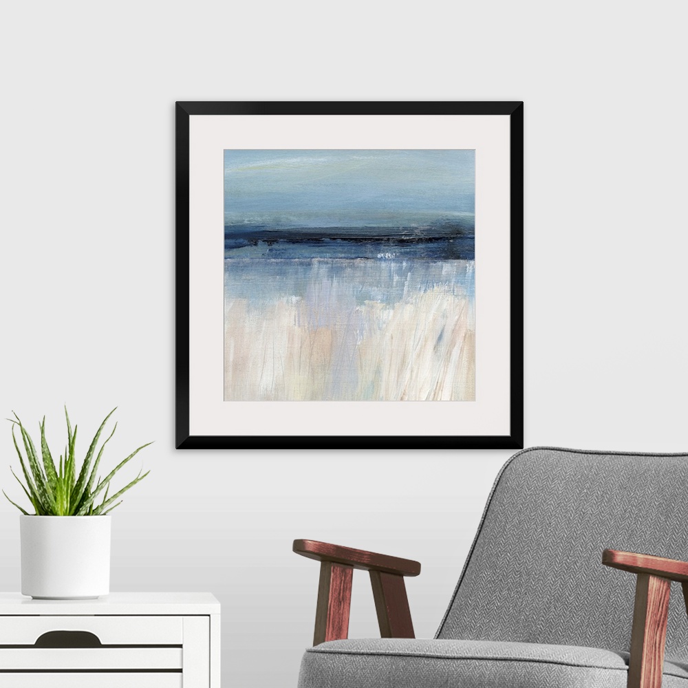 A modern room featuring Square abstract painting of a seascape with the sandy beach at the bottom and the ocean and sky a...
