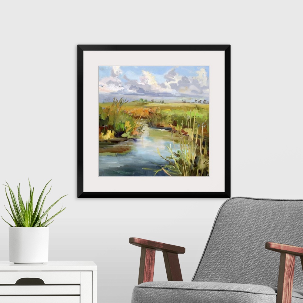A modern room featuring A contemporary painting of a marshland under a blue sky.