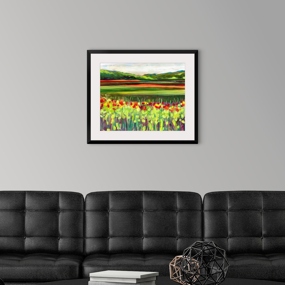 A modern room featuring Large, landscape fine art painting of a meadow of wildflowers in front of a green hillside on the...