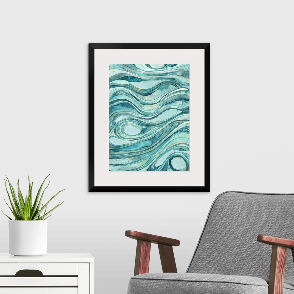 A modern room featuring Contemporary abstract watercolor artwork in blue shades, resembling waves of flowing water.