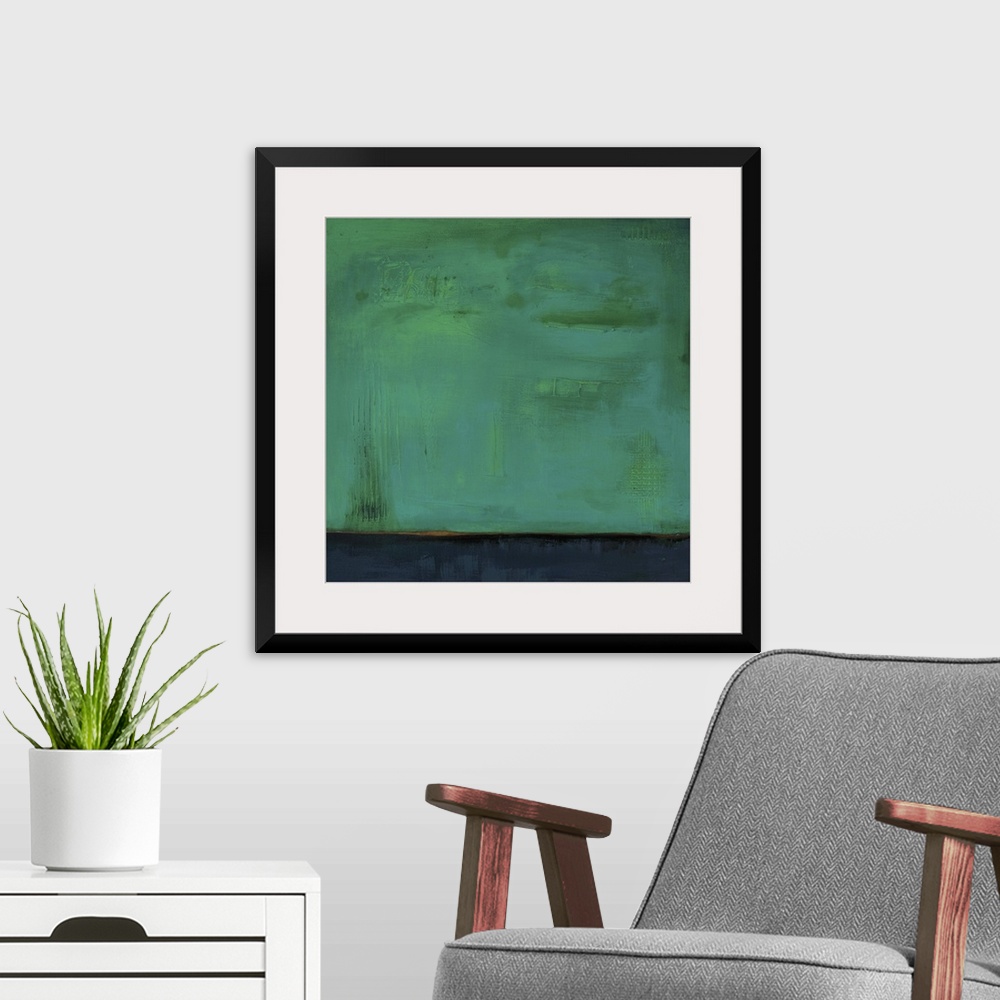 A modern room featuring Square, abstract painting featuring large blocks of color in green and dark blue/gray