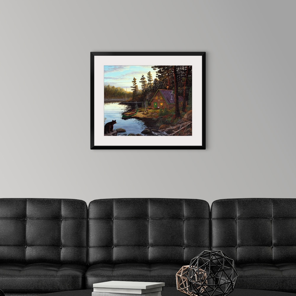 A modern room featuring Photograph of cabin in the woods by lake with canoe under a cloudy sky.  There is a bear on the o...