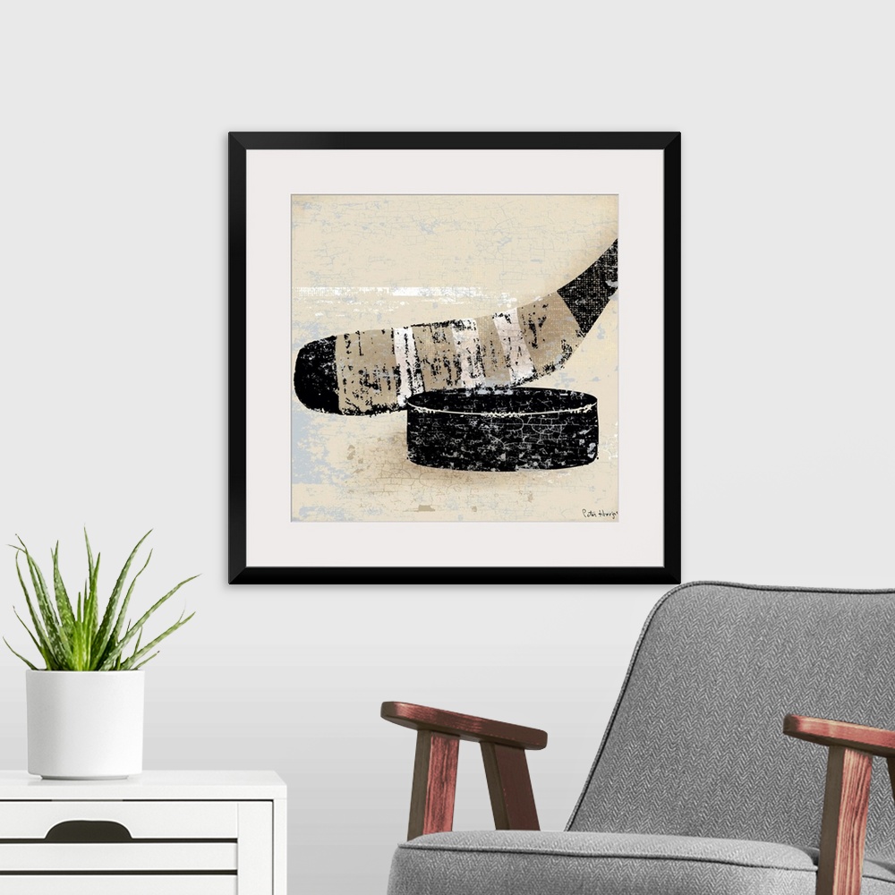 A modern room featuring Vintage style wall art of an old distressed hockey stick and puck on tan and sepia background.
