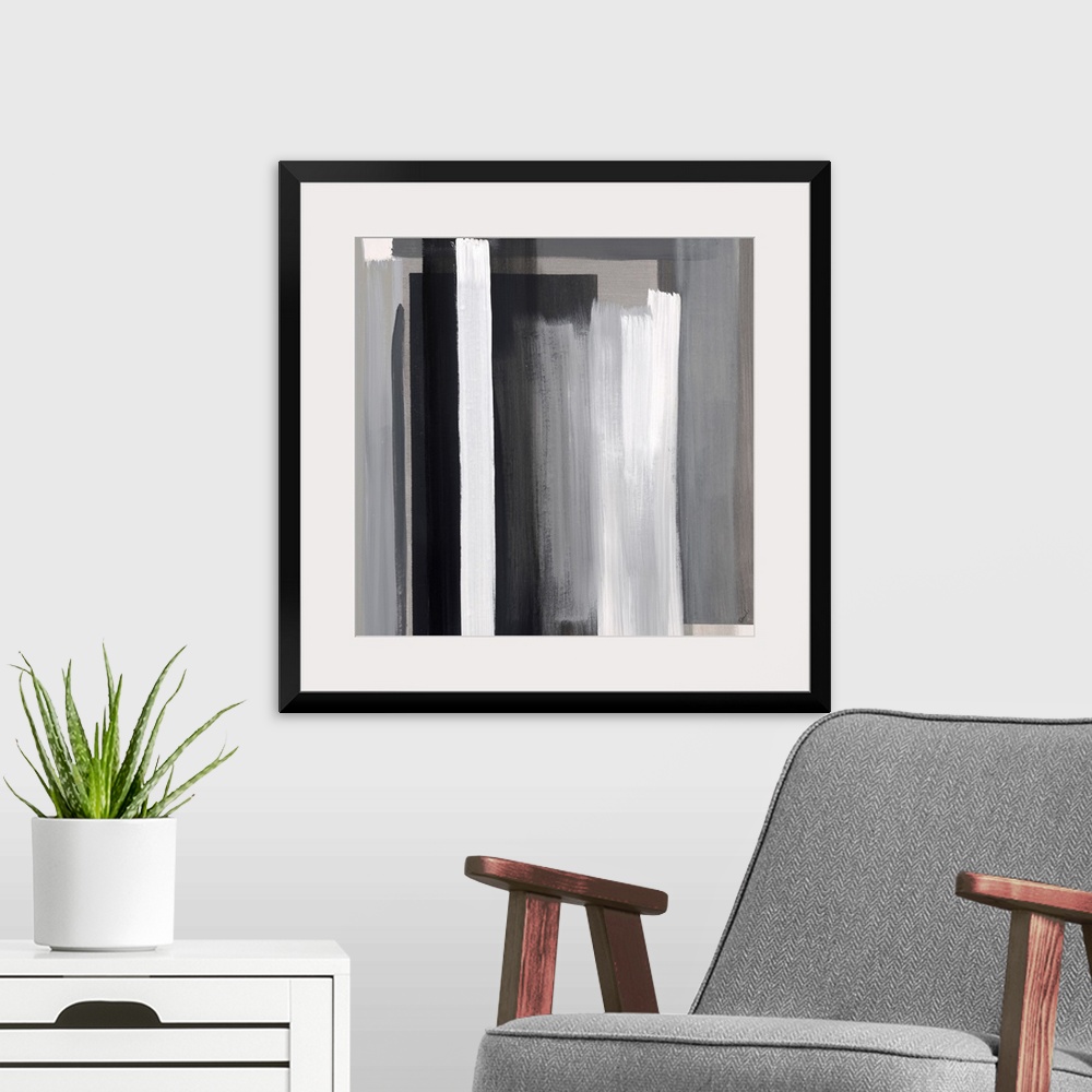 A modern room featuring Abstract artwork of layered color blocks in white and black.