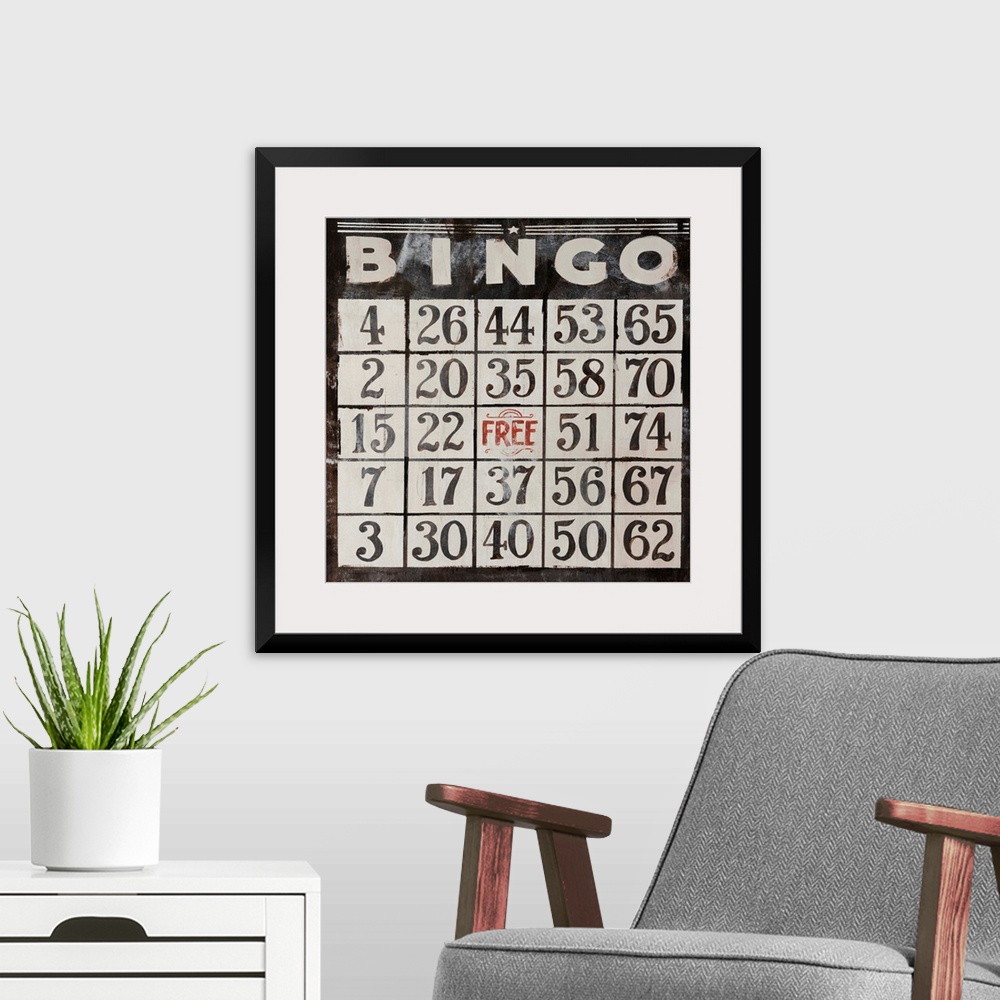 A modern room featuring This large piece has an antique style Bingo card that takes up the entire face of artwork.