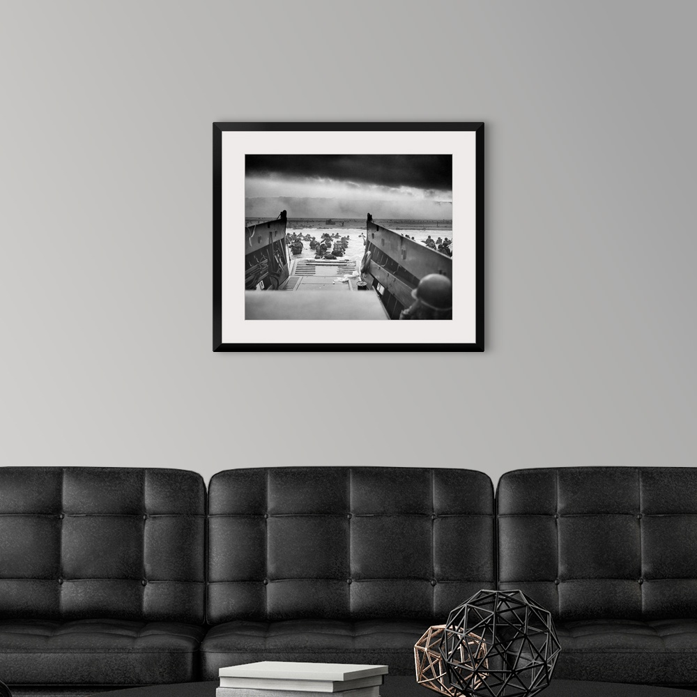 A modern room featuring Digitally restored vintage World War II photo of American troops wading ashore on Omaha Beach dur...
