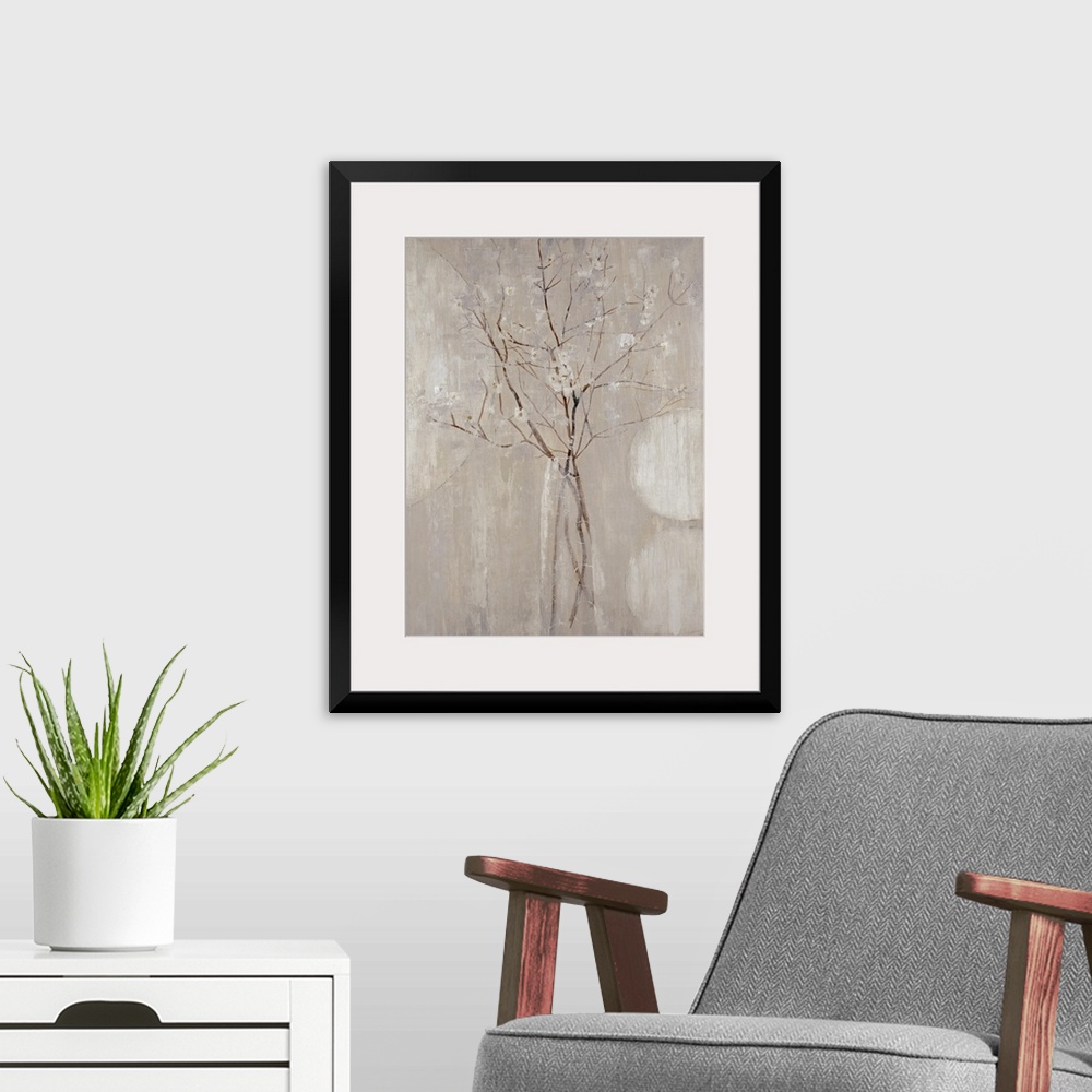 A modern room featuring A monochromatic vertical painting of  twigs with tiny flowers.