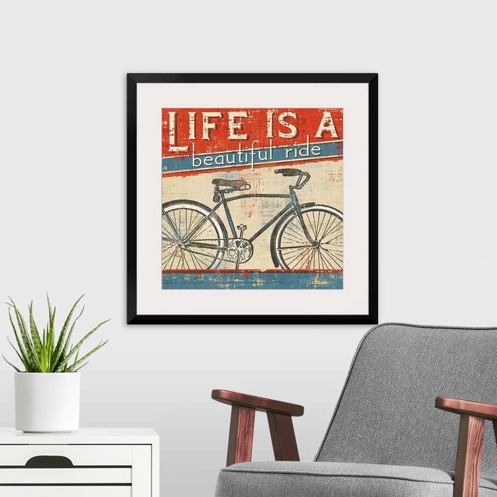 A modern room featuring Square wall art of a bicycle with retro typography inspired by vintage posters.