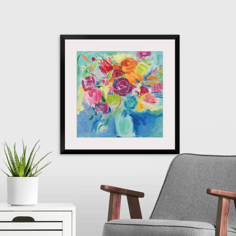 A modern room featuring Square abstract painting of a bright Spring floral arrangement on a blue and green background.