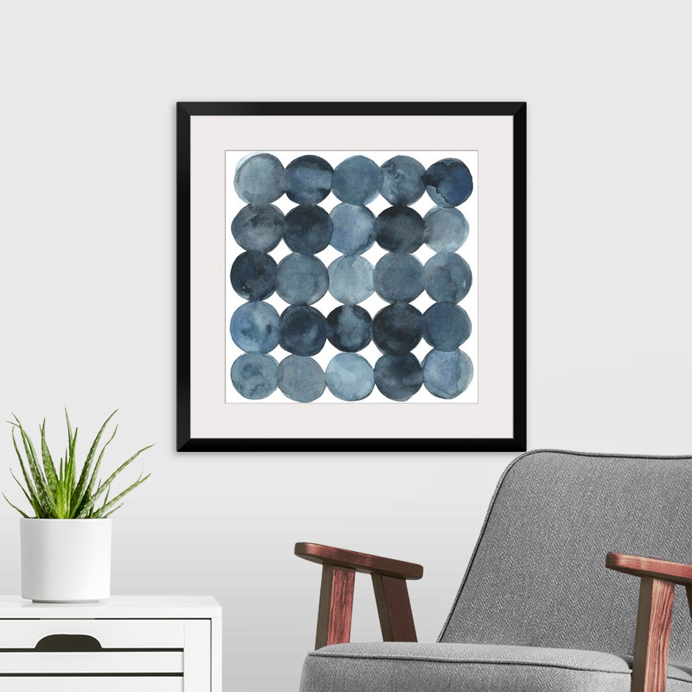 A modern room featuring Dot-patterned abstract watercolor painting of blue-gray tones.
