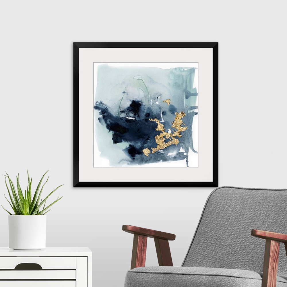 A modern room featuring Watercolor painting of chaotic brush strokes of blue/gray tones with metallic gold leaf accents.
