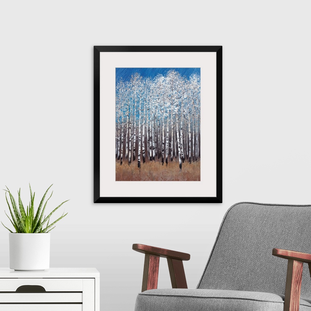 A modern room featuring Contemporary painting of a forest of white birch trees under a blue sky.