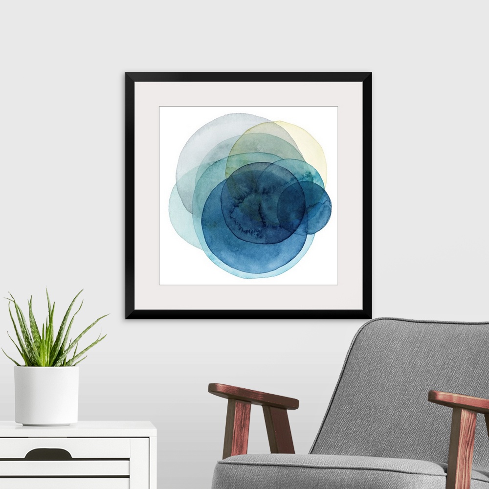 A modern room featuring Inspired by the cosmos, these spinning watercolor circles resemble the orbit a planet takes in sh...