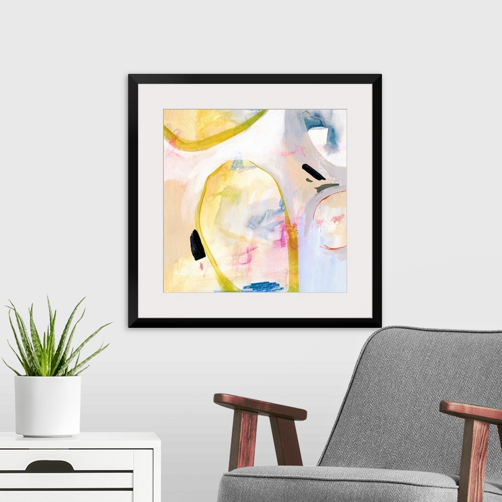 A modern room featuring Contemporary abstract painting in various colors with large circular shapes in bright yellow.