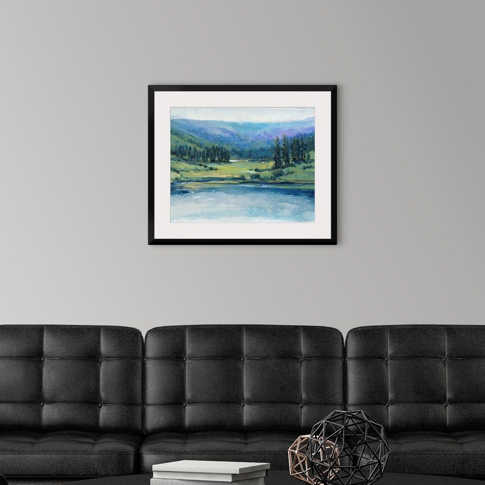 A modern room featuring Large landscape painting with cool tones of a hilly wilderness landscape with a lake in the foreg...