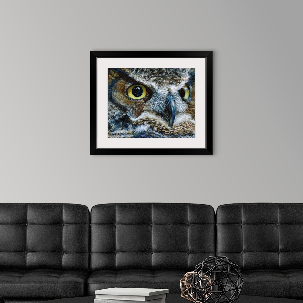 A modern room featuring Contemporary artwork of a close-up look of an owl face.