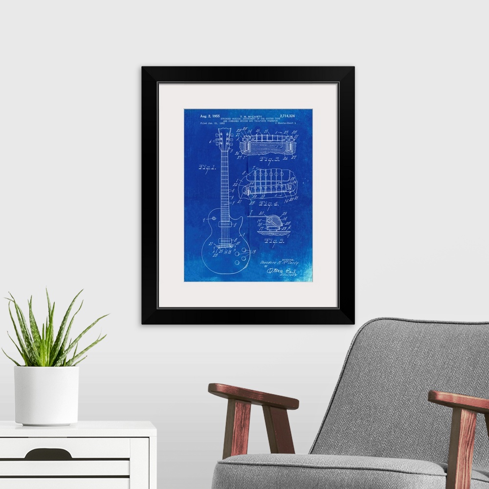 A modern room featuring Faded Blueprint Gibson Les Paul Guitar Patent Poster