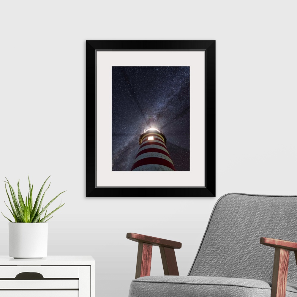 A modern room featuring Photograph looking up at a red and white striped lighthouse to a purple and blue starry sky with ...