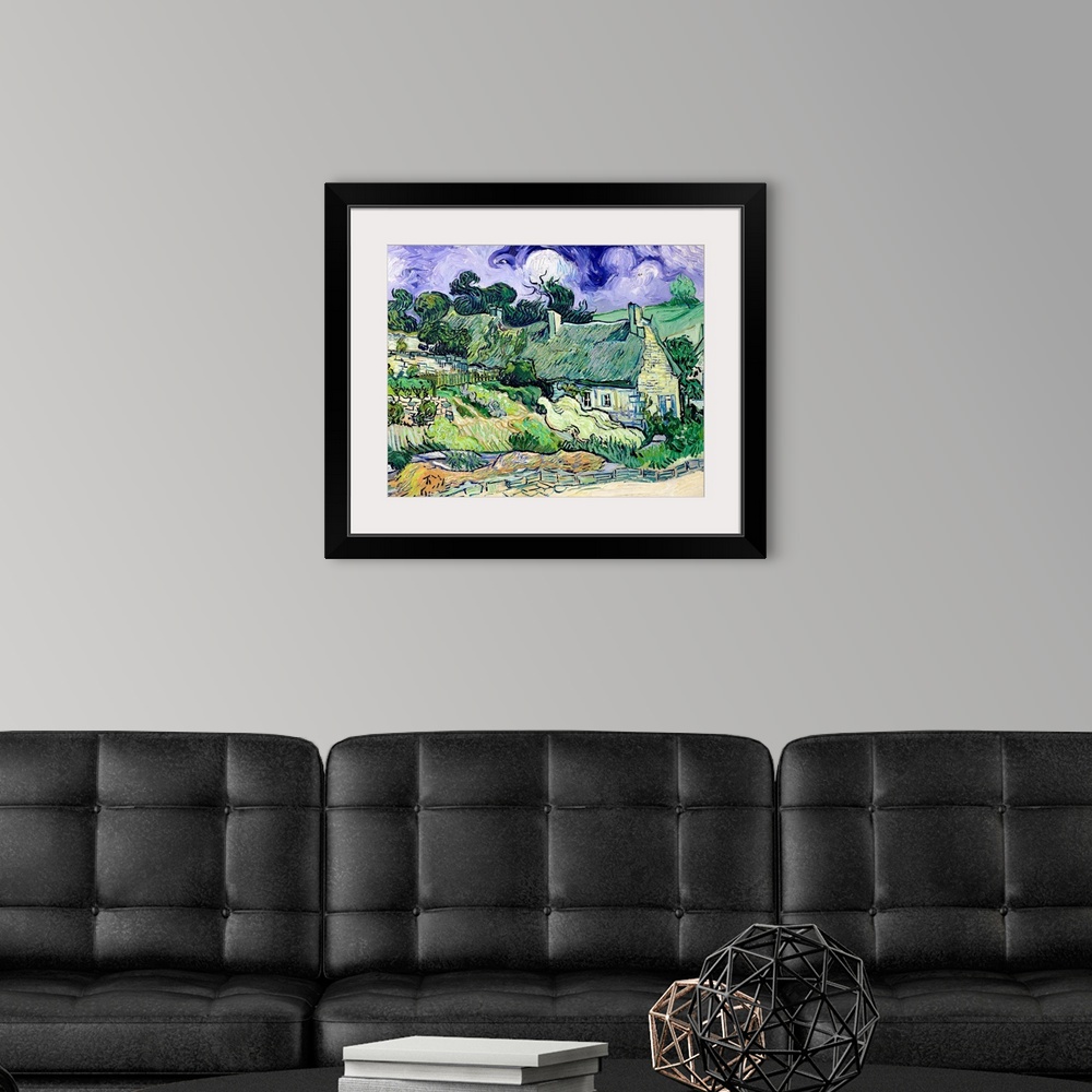 A modern room featuring Big classic art portrays a landscape filled with houses behind a cobblestone walkway in a rural a...