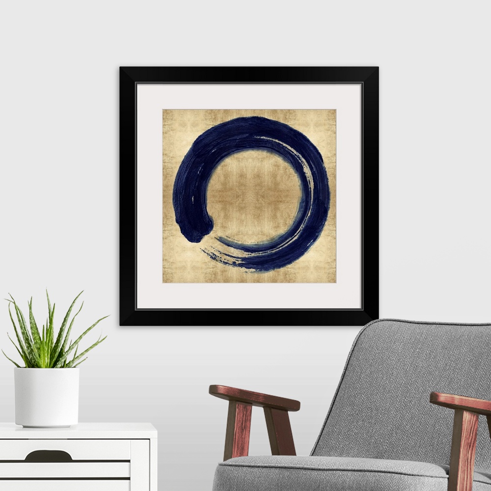 A modern room featuring This Zen artwork features a sweeping circular brush stroke in blue over a mottled gold color back...