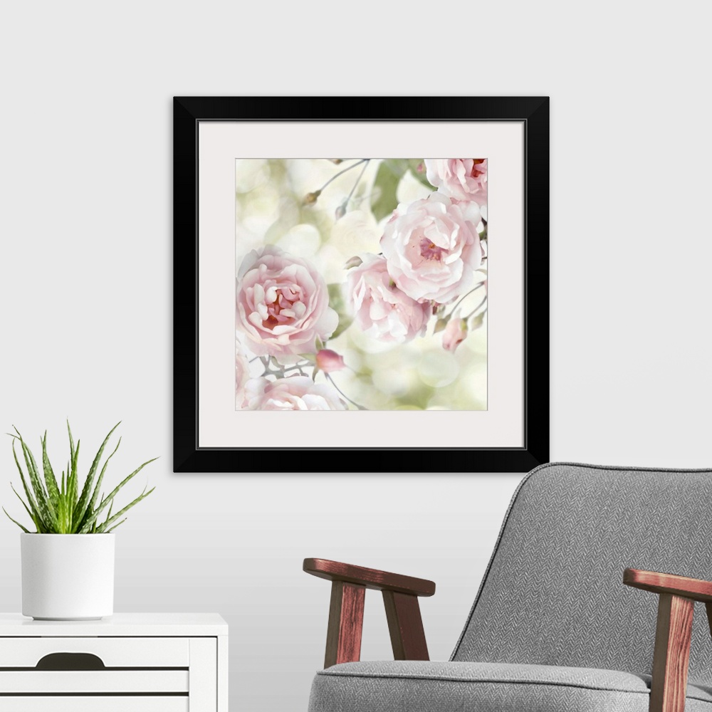 A modern room featuring Decorative artwork featuring soft flowers in shades of pink over a bokeh background.