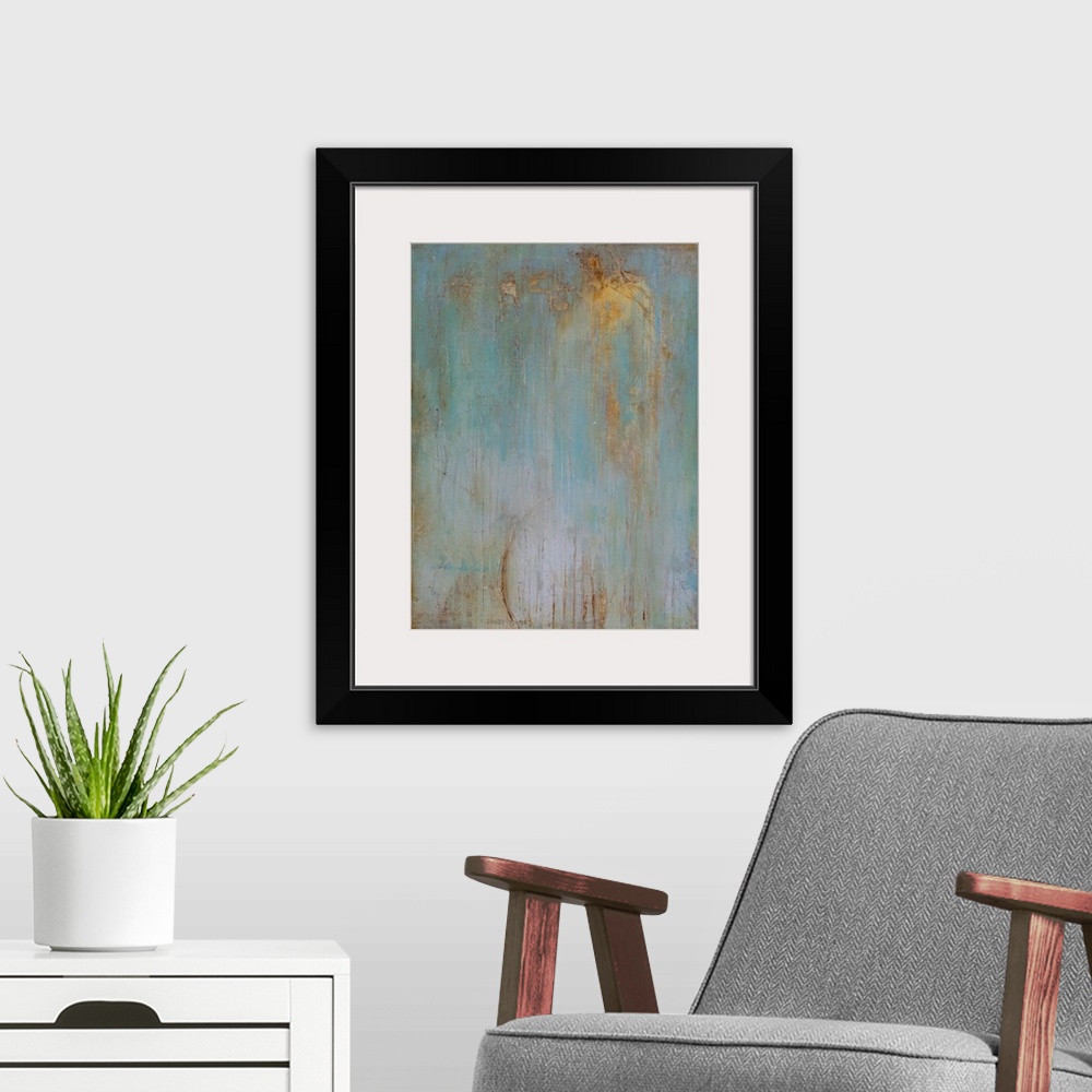 A modern room featuring Vertical abstract painting created with a muted blue turning into gray with streaking lines in go...