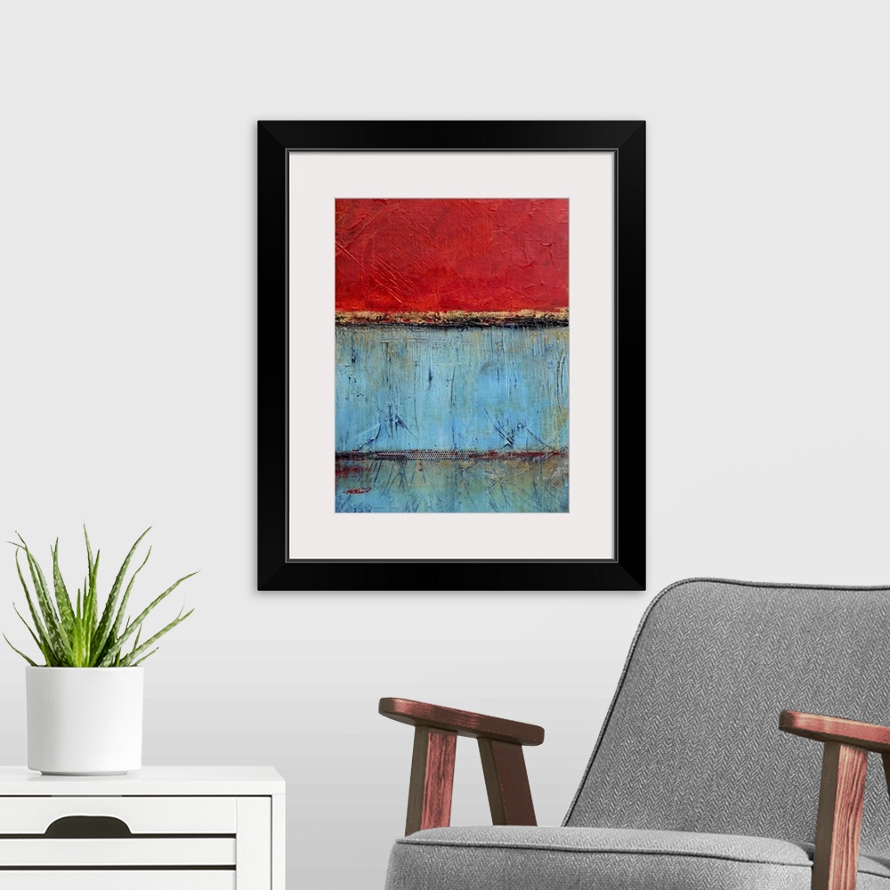 A modern room featuring Contemporary abstract painting using bright red and blue contrasting with each other.