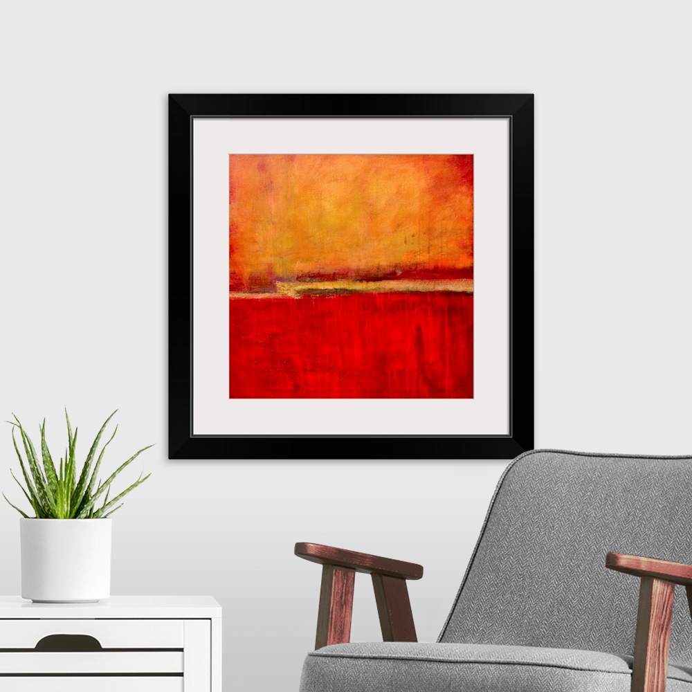 A modern room featuring Square abstract artwork in fiery red and orange tones with simple, bold areas of color, resemblin...