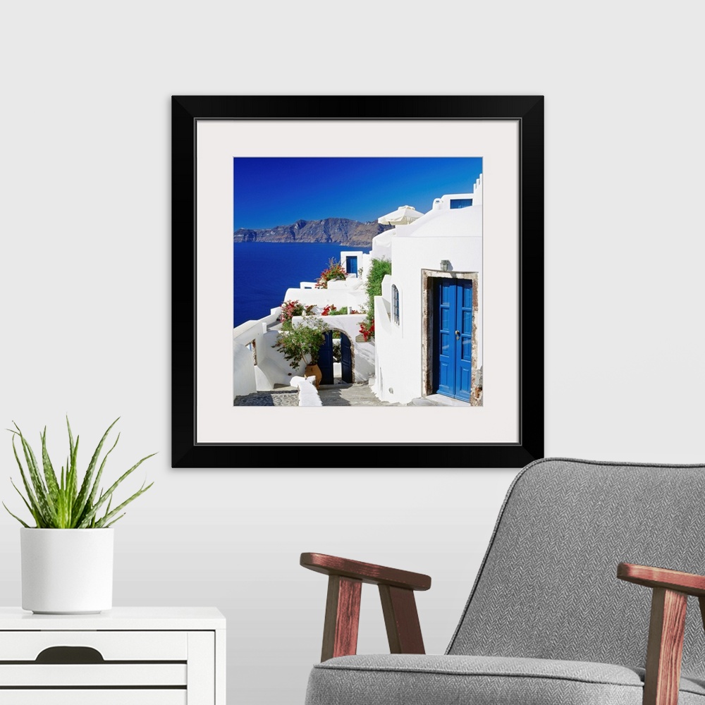 A modern room featuring Greece, Aegean islands, Cyclades, Santorini, traditional houses and the crater