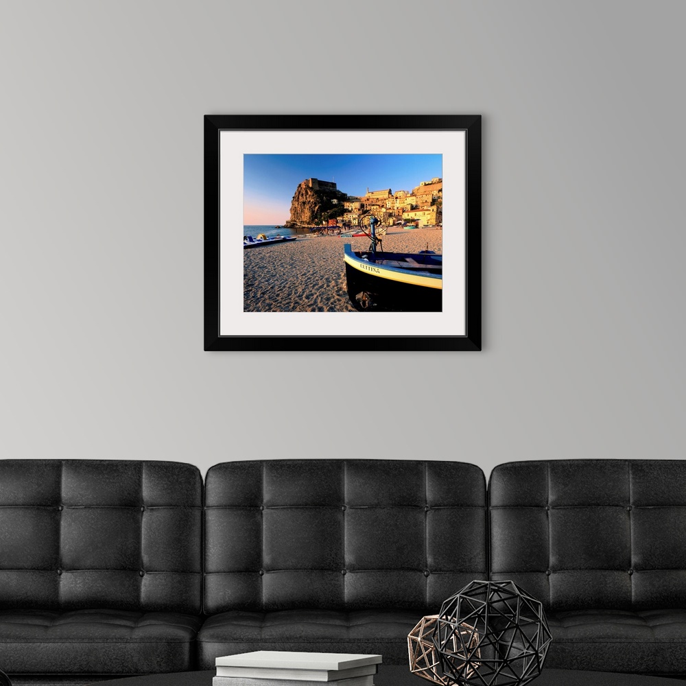 A modern room featuring Italy, Calabria, Scilla, view on town and beach