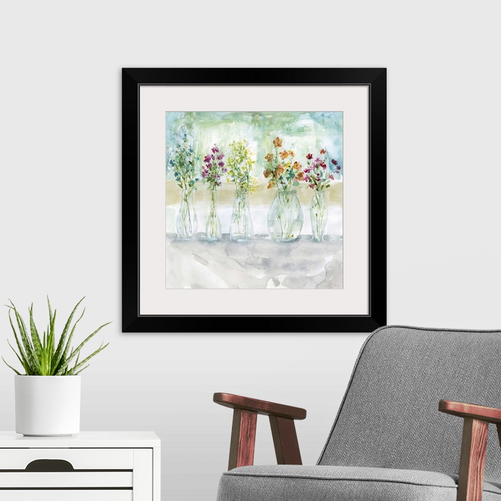 A modern room featuring Square watercolor painting of five vases filled with wildflowers.