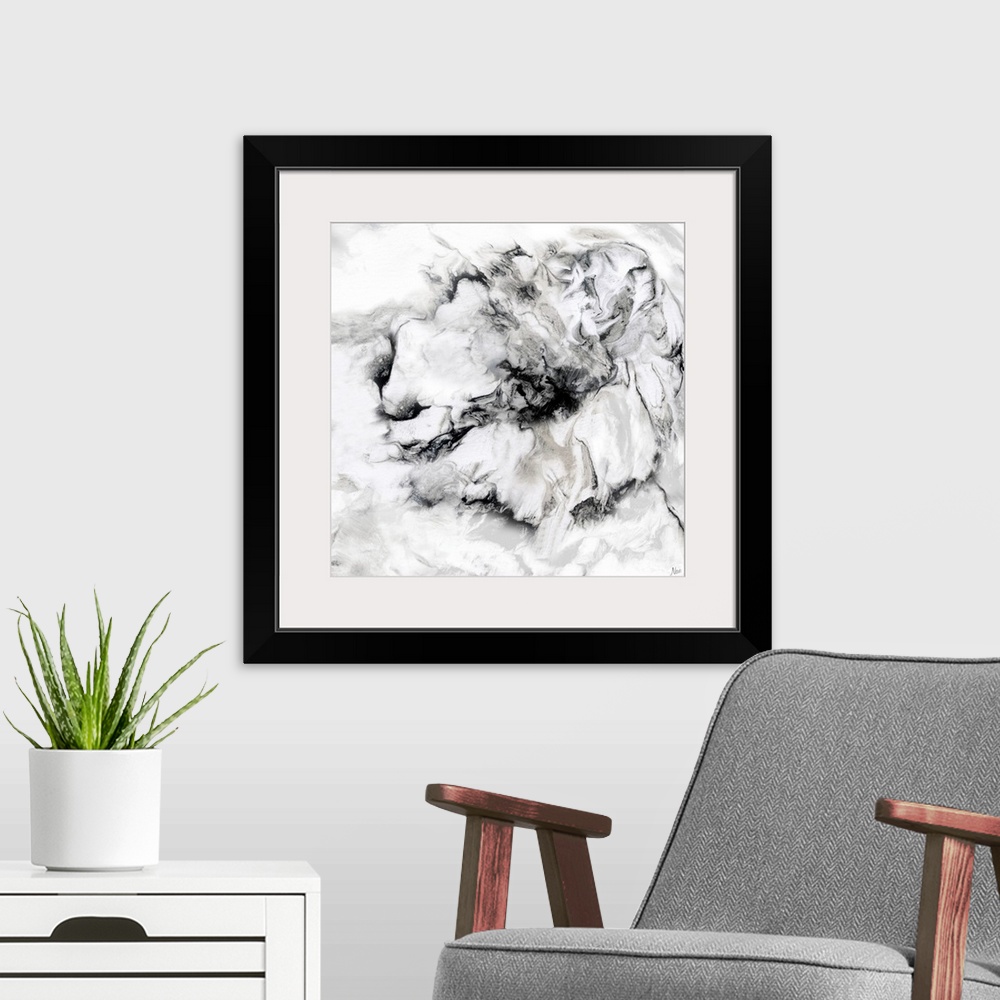 A modern room featuring Black and white art print of a flower with a wavy, marbled effect.