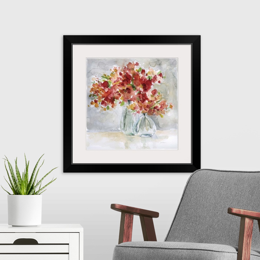 A modern room featuring Beautiful square watercolor painting of red and orange flowers in glass vases on a gray and tan b...