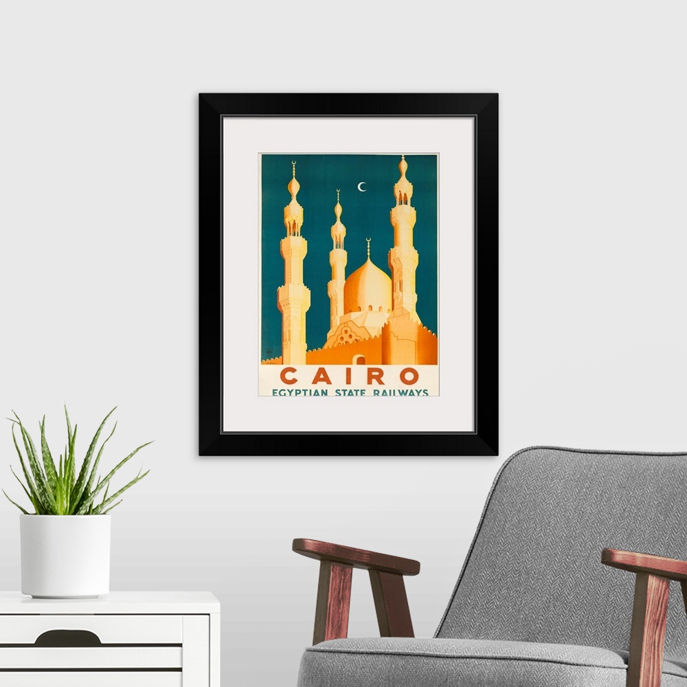 A modern room featuring 1930s Ciaro Egypt travel poster showing golden Mosques and minarets in the moonlight