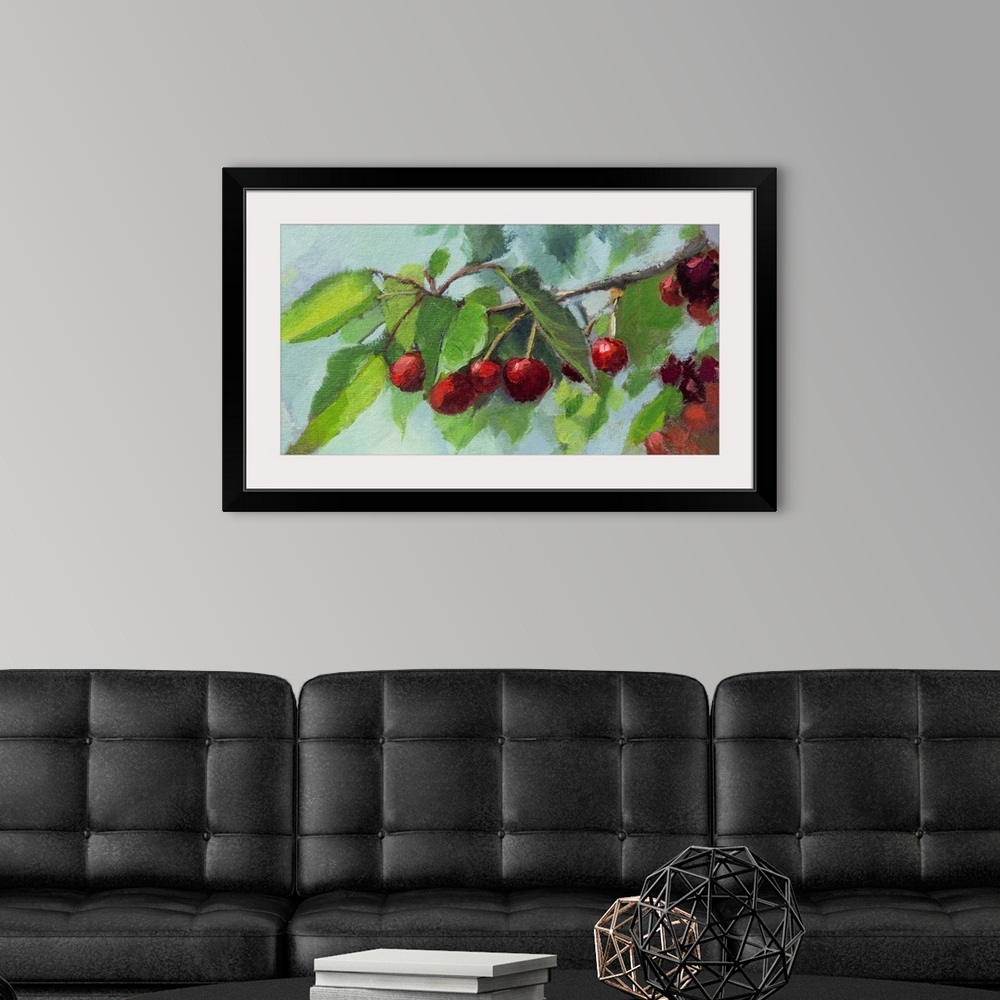 A modern room featuring Bright scarlet cherries on a branch.