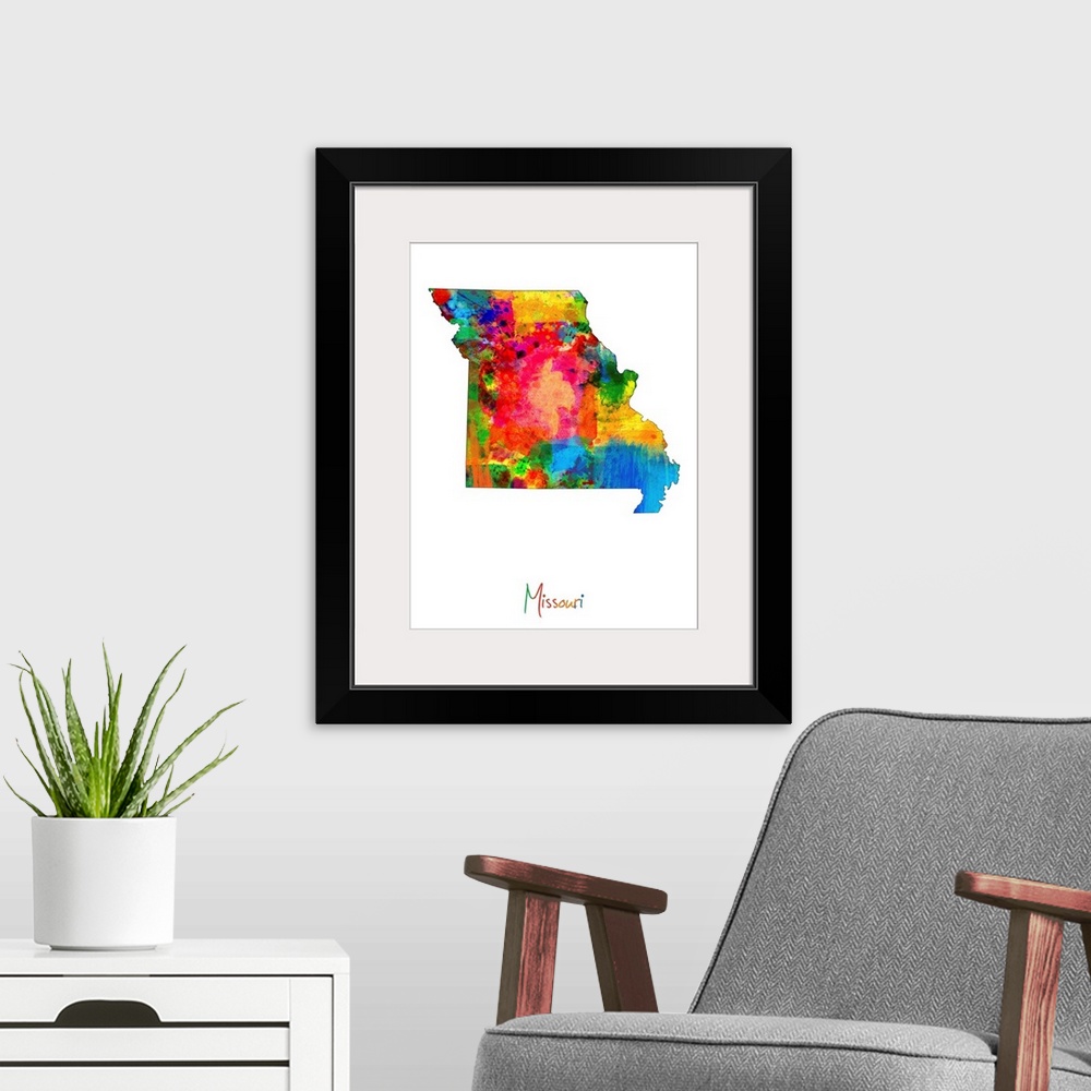 A modern room featuring Contemporary artwork of a map of Missouri made of colorful paint splashes.