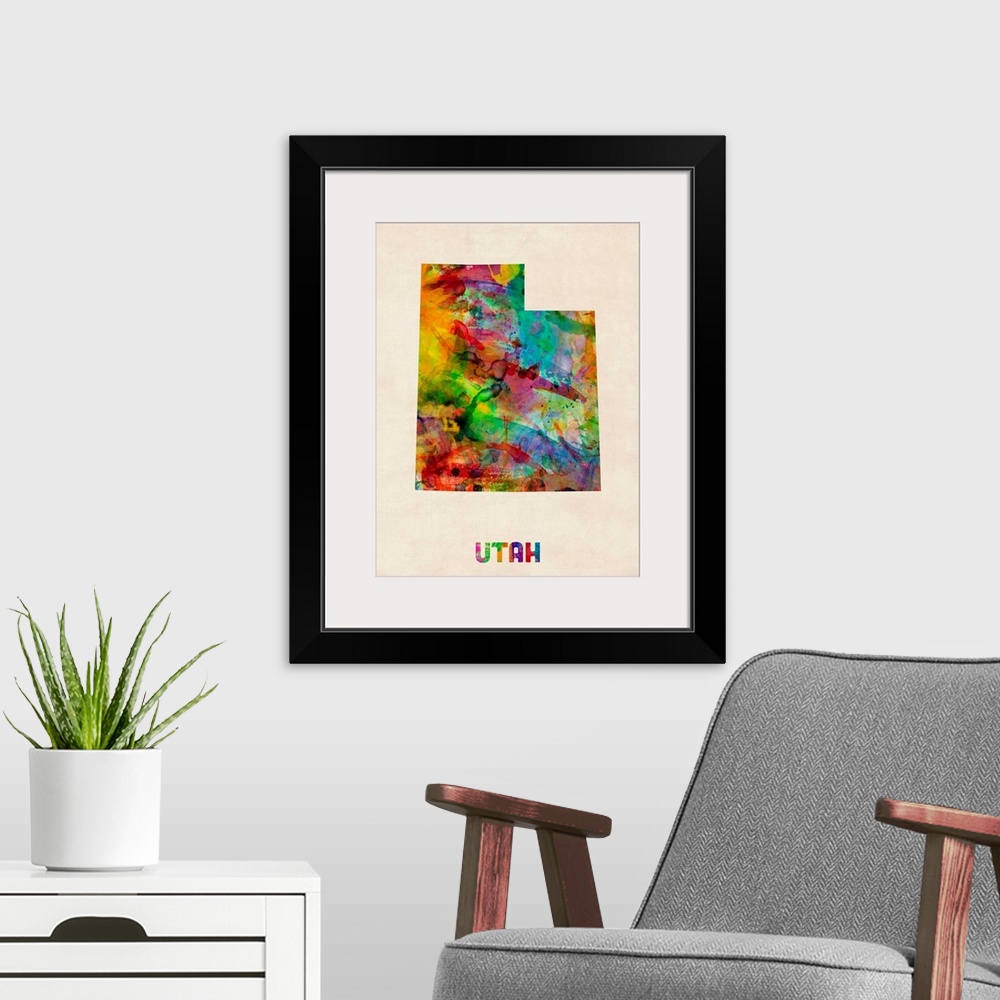 A modern room featuring Contemporary piece of artwork of a map of Utah made up of watercolor splashes.