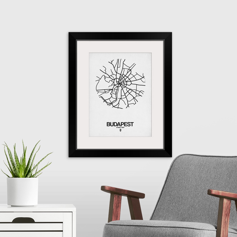 A modern room featuring Minimalist art map of the city streets of Budapest in white and black.