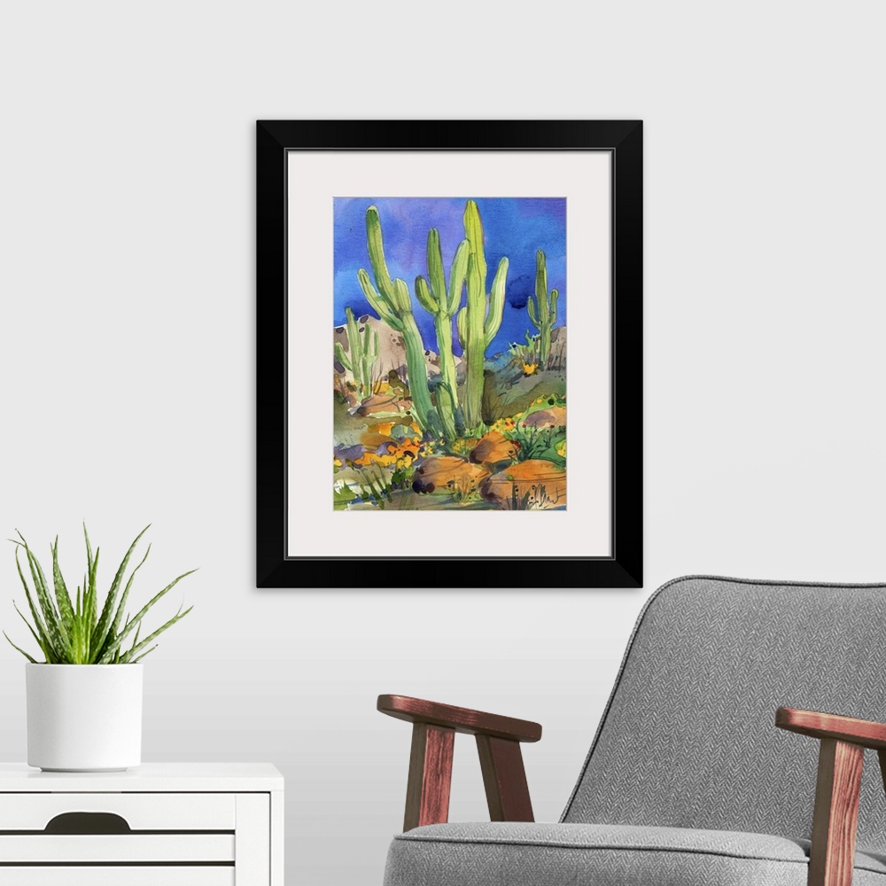 A modern room featuring Watercolor painting of saguaro cacti in a rocky desert.