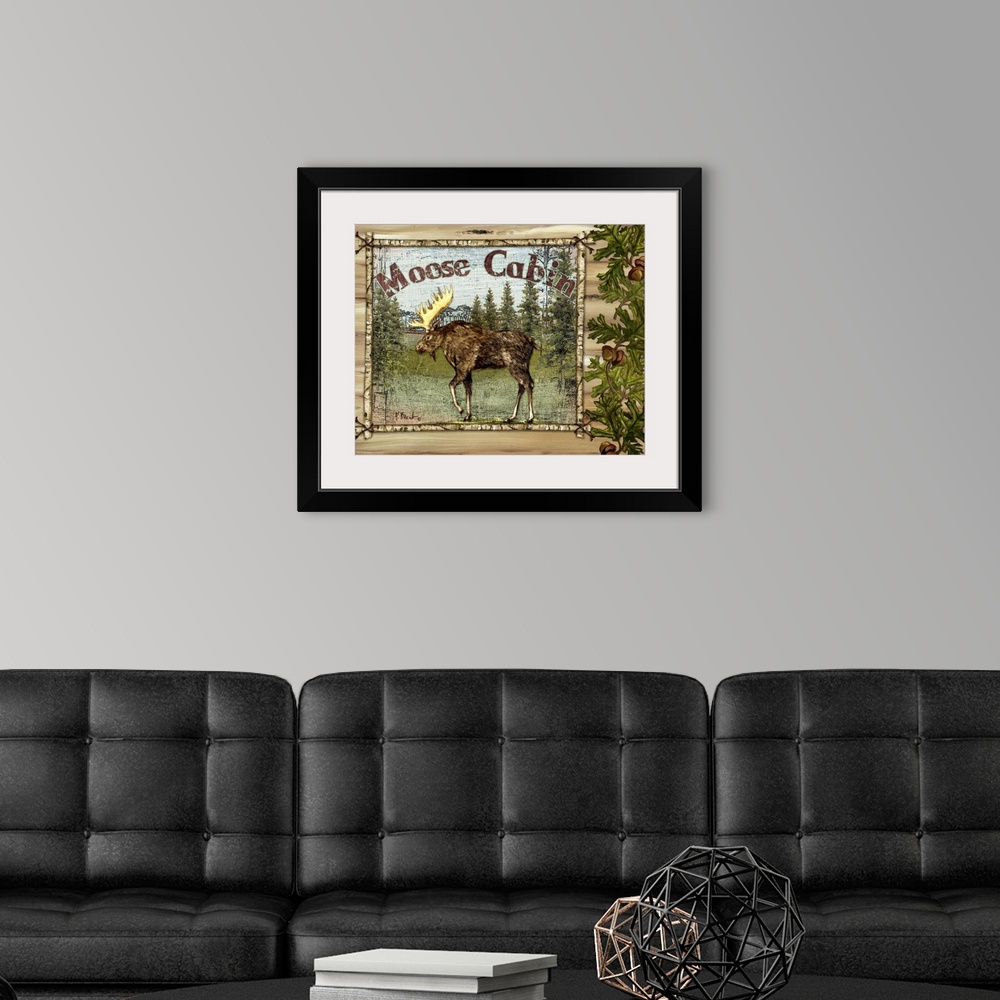 A modern room featuring Decorative artwork of a moose in a frame, with oak leaves, acorns, and the words Moose Cabin.