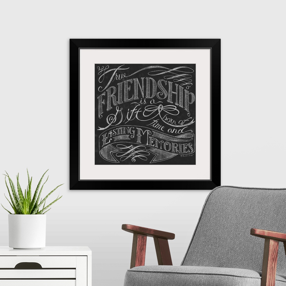 A modern room featuring Typography art of an inspirational quote about friendship, done in a chalkboard art style.